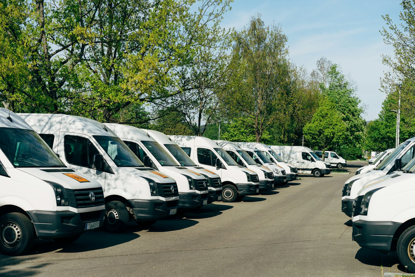 Aerial view of a delivery fleet staged at a depot ready for routing